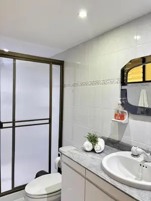a bathroom with a toilet and a sink at Unbeatable location in Medellín in Medellín