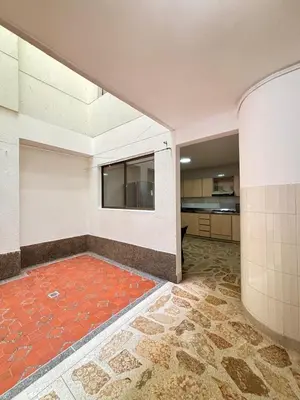 an empty room with a red rug on the floor at Unbeatable location in Medellín in Medellín
