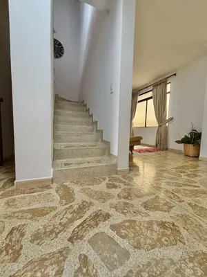 an empty hallway with a staircase in a house at Confort y Estilo en el Centro de Medellín Perfecto para tu Estancia in Medellín