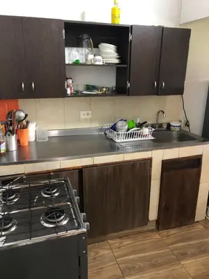 a kitchen with a stove and a sink at Villa Graciela in Horizonte
