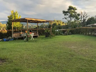 a picnic table under a canopy in a yard at Villa Graciela in Horizonte