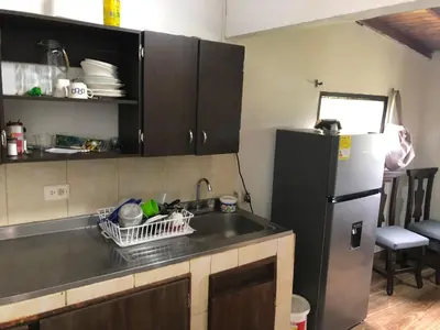 a kitchen with a sink and a refrigerator at Villa Graciela in Horizonte