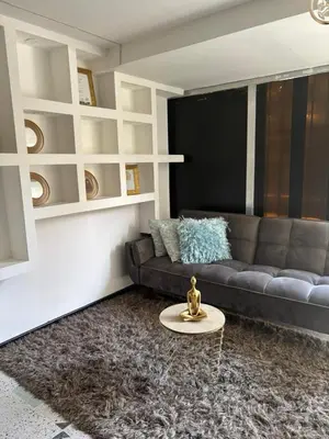 a living room with a couch and a table at Jireh alojamientos in Medellín