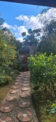 a stone path in front of a building at Moss in San Isidro