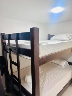 a couple of bunk beds in a room at Apartamentos laureles estadio 101 ED MILA in Medellín