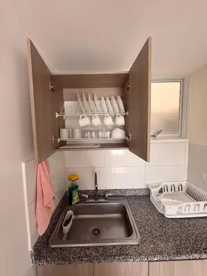 a kitchen counter with a sink and a window at Apartamento en Manizales in Manizales