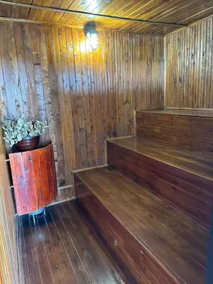a wooden sauna with a potted plant in it at Villa Santa Luz in La Pradera