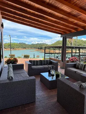 a patio with couches and a view of a river at Villa Santa Luz in La Pradera