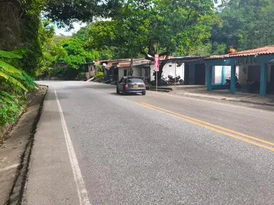 a car parked on the side of a road at hotel salome in Puerto Triunfo