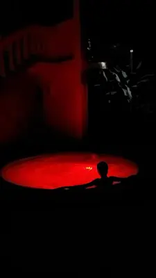 a person is standing on a red skateboard at hotel salome in Puerto Triunfo
