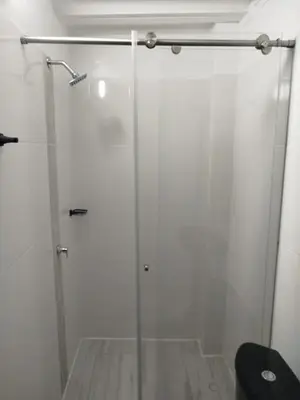 a shower with a glass door in a bathroom at hotel salome in Puerto Triunfo