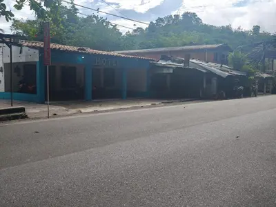 a building on the side of a street at hotel salome in Puerto Triunfo
