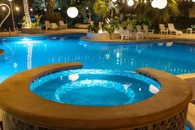 a swimming pool in a hotel with a large pool at Palma Serena Finca Hotel in Santa Fe de Antioquia