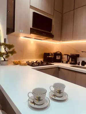 two cups sitting on a counter in a kitchen at Apartment suite Encanto de Caldas in Ruiosucio