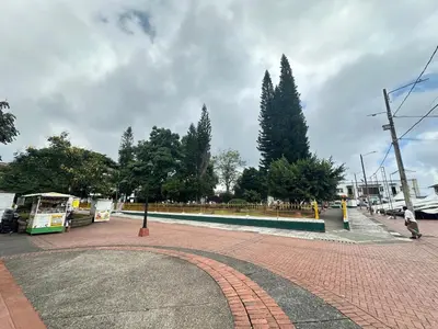 a brick walkway in a park with trees in the background at Apartment suite Encanto de Caldas in Ruiosucio