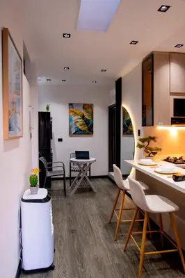 a kitchen and living room with a table and chairs at Apartment suite Encanto de Caldas in Ruiosucio