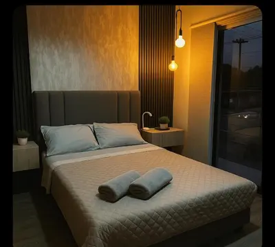 a bedroom with a bed with two pillows on it at Apartment suite Encanto de Caldas in Ruiosucio