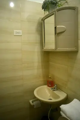 a bathroom with a sink and a mirror at La 47 House - Family House in Manizales in Manizales