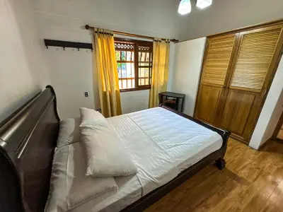 a bedroom with a large bed and a window at Casa Finca Villa Laura 158 in Rionegro