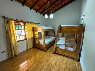 a room with two bunk beds and a window at Casa Finca Villa Laura 158 in Rionegro