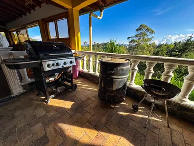 a grill and a trash can on a balcony at Casa Finca Villa Laura 158 in Rionegro