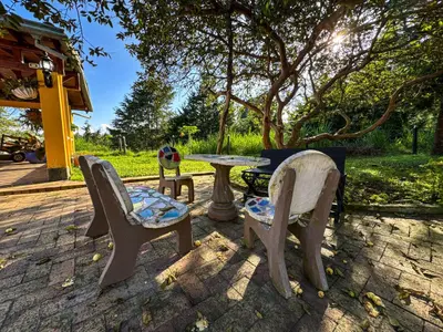 a table and two chairs and a table and a table at Casa Finca Villa Laura 158 in Rionegro