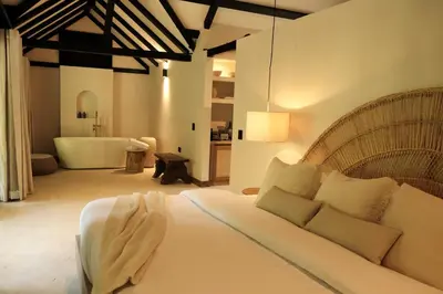 a bedroom with a bed and a tub in a room at Isla Clara Hotel in San Francisco