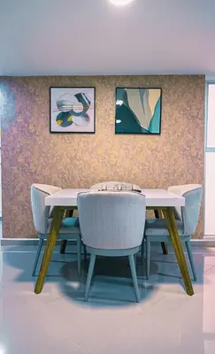 a dining room with a table and chairs at 901-Apartamento Central Parque de Sabaneta in Sabaneta