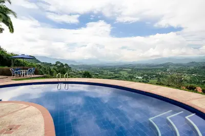 a swimming pool with a view of the mountains at Altos de Balaguer in Magallenes