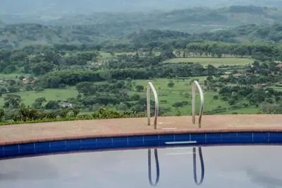 a swimming pool with a view of a mountain at Altos de Balaguer in Magallenes