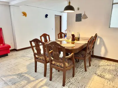 a dining room with a wooden table and chairs at CASA JAGUAR 4 Habitaciones, 4 Baños in Medellín