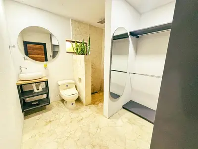 a bathroom with a toilet and a sink and a mirror at Villa Sol in Sopetran