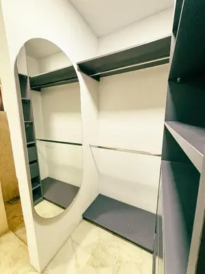 a walk in closet with a round mirror at Villa Sol in Sopetran