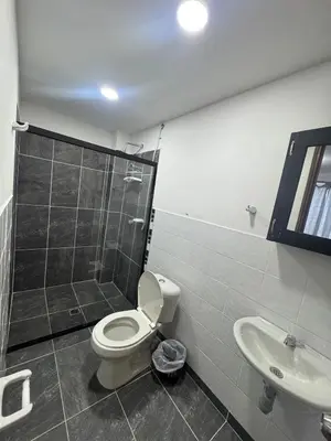 a bathroom with a toilet and a shower and a sink at Apartmento 302 t1 Sol de Occidente in Sopetran