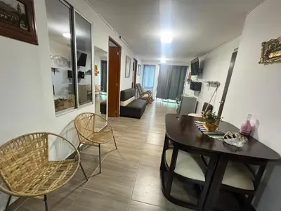 a living room with a table and chairs at Apartmento 302 t1 Sol de Occidente in Sopetran