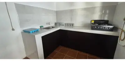 a small kitchen with a sink and a stove at Hospedaje en Marulanda in Marulanda