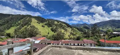 a view of a village with mountains in the background at Hospedaje en Marulanda in Marulanda