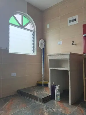 a room with a fireplace and a window at La Arboleda Apartamento in Manizales
