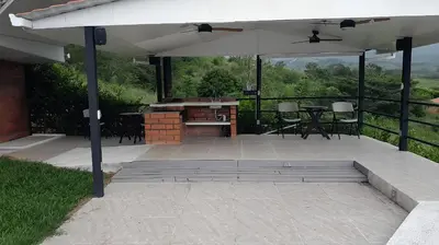 a patio with a table and an umbrella at Colombia Escape - Cafe Acapulco Extasis in Viterbo