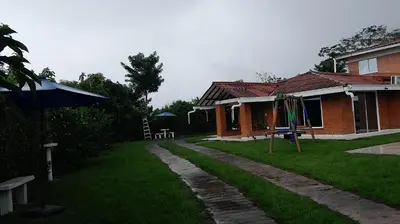a house with a playground in front of a yard at Colombia Escape - Cafe Acapulco Extasis in Viterbo