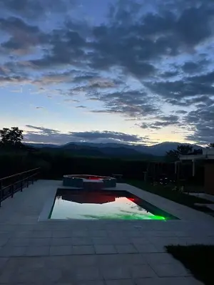 a swimming pool with a view of the mountains at Colombia Escape - Cafe Acapulco Extasis in Viterbo