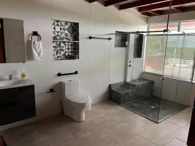 a bathroom with a shower and a toilet and a sink at Colombia Escape - Cafe Acapulco Extasis in Viterbo