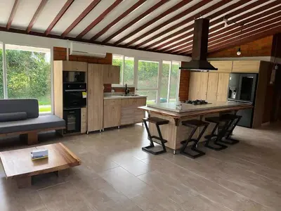 a large kitchen with a table and a couch at Colombia Escape - Cafe Acapulco Extasis in Viterbo
