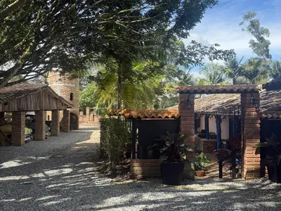a row of houses with trees and a building at Sweet Helen Casa Santa in Rionegro