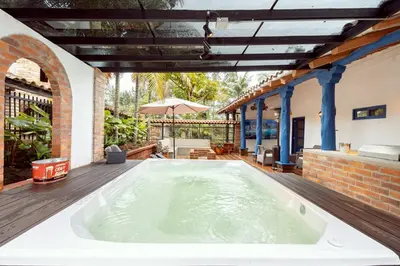 a large bath tub in the middle of a house at Sweet Helen Casa Santa in Rionegro