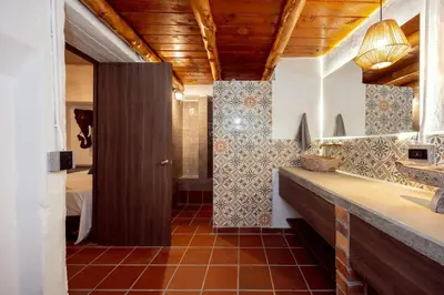 a bathroom with a sink and a shower at Sweet Helen Casa Santa in Rionegro
