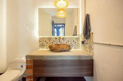 a bathroom with a sink and a mirror at Sweet Helen Casa Santa in Rionegro