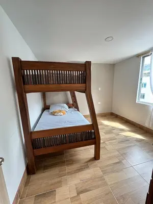 a room with a bunk bed in the corner at Resort in Sopetrán 402 t5 sol de occidente in Sopetran
