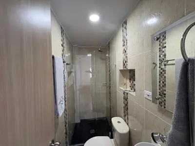 a bathroom with a shower and a toilet and a sink at Resort in Sopetrán 402 t5 sol de occidente in Sopetran