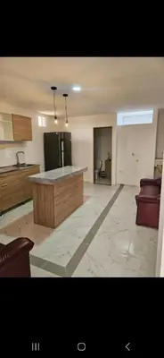 a large kitchen with a island in the middle at Vacacional amoblado Doradal 302 in Doradal